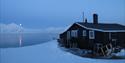 View from Slettebu over Van Mijenfjorden with the moon shining in the distance