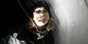 A portrait where the person is looking through an ice floe.
