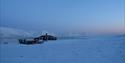 Slettebu seen from the outside in a snowy landscape