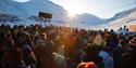 A crowd celebrating the sun's return to Longyearbyen after the dark season