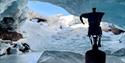 Primus coffeekettle, standing on a piece of ice, inside an icecave