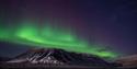 northern lights above a mountain