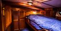 Bunk bed in the sailboat’s cabin.