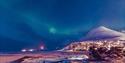 Longyearbyen underneath the Northern lights.