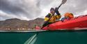 A guest who is paddling in a kayak