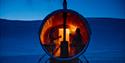 People enjoying a stay in the sauna in the evening