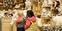 Two children in Svalbardbutikken's souvenir and gift department