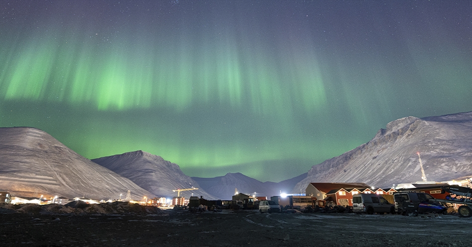northern lights all over Longyearbyen town