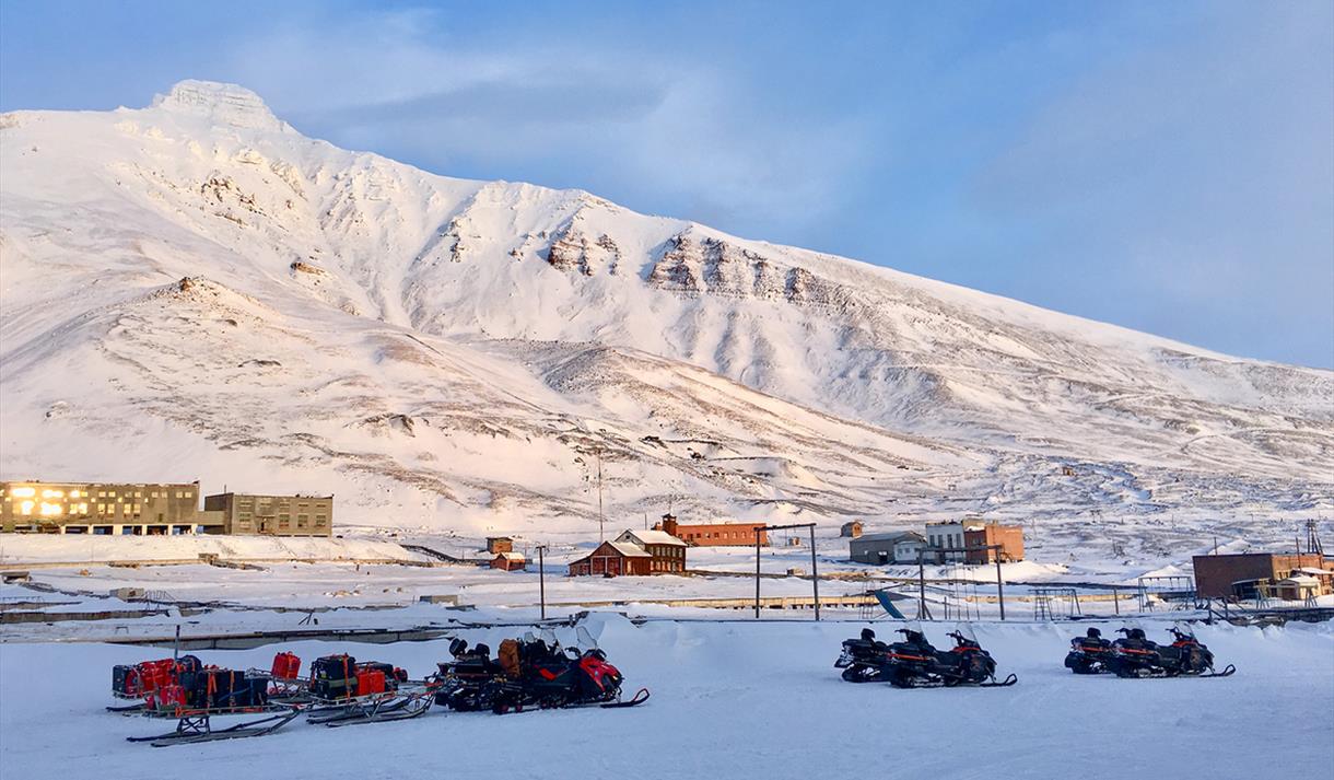 Snowmobiles parked in Pyramiden