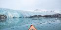 View from a kayak towards a glacier front