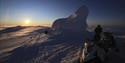 Midnightsun seen from the snowcovered summit