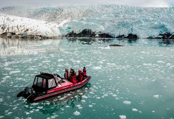 A RIB boat in front of the Nordenskiöld Glacier