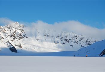 Skiers in a mountainous landscape