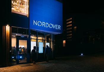 Persons outside the entrance door to Nordover