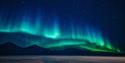 Northern Lights shining above mountains