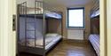 A bedroom with two bunk beds