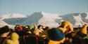 A crowd celebrating the sun's return to Longyearbyen after the dark season