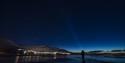 A person looking for northern lights outside of Longyearbyen