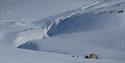 Arctic Husky Travellers sin hytte på vinterstid