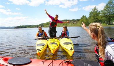 people having fun kayaking