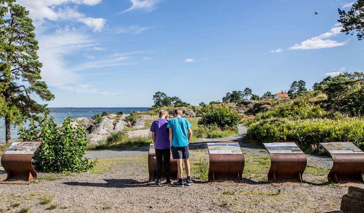 2 boys at the Geopark boards at Rognstranda