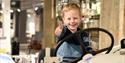 little boy sitting on a porcelain car at Porsgrund's Porcelain Factory