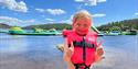 little girl in front of the water park at Hulfjell family park