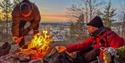 people are sitting around a campfire on Borgåsen