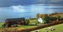 farm by the water in Vinje