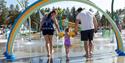 family with a small child in the splash park at Bø Sommarland