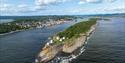 drone image of Langøya with Langøytangen lighthouse