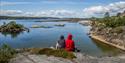 2  siting on a reef and looks out over the water