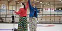 2 girls curling in Skien leisure park
