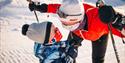 mother and son look at each other happily during the ski trip on Lifjell