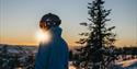 man looking at winter landscape