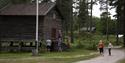 Old buildings at Drangedal bygdetun. People walking around