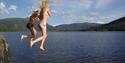 2 girls jump in the water