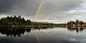 man paddling in a canoe on a lake in Fyresdal