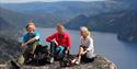 boy and 2 girls sitting on top of Igletjønnuten in Fyresdal