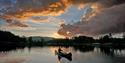 man paddling in a canoe at Fiskebusøylen