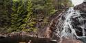 lady bathing at the Garvann falls