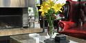 flowers on the table in front of the fireplace at Ski Lodge Gautefall