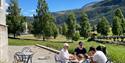 family sitting at Holm Landhandel's outdoor cafe