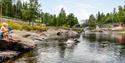 Man swimming at Omnesfossen swimming area.
