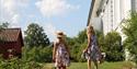 Girls in the garden at Henrik Ibsen Museum Venstøp in Skien