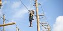 boy climbs in the climbing park in the Skien leisure park