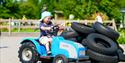 little boy on tractor