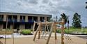 The newly built Hotell fritidsparken from the outside with a playground