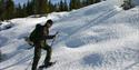 man walking on snowshoes