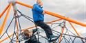 Children playing in a climbing frame.